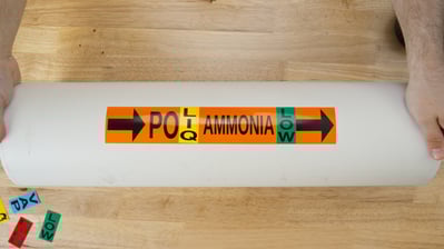 Ammonia pipe marking on labeled pipe.