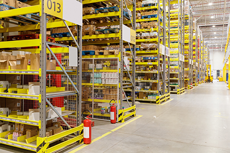 A warehouse organized with 5S and safety labels and marking tape