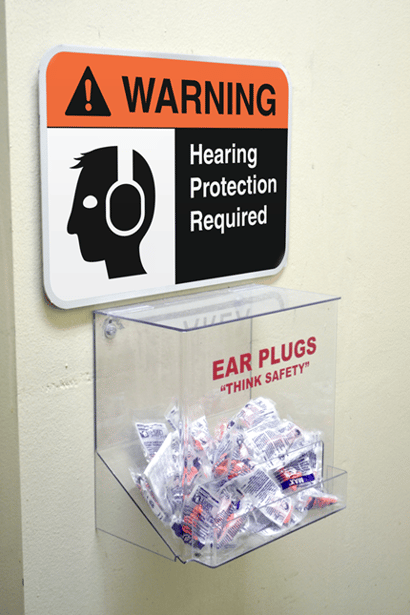 Signs alert workers to earplug stations.