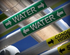  Pipe identification with custom water and condenser labels for industrial systems.