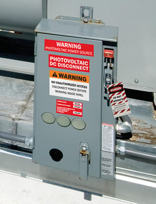 Labels identify energy and electrical sources for safety.