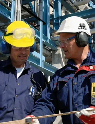Workers discussing a Lean 5S plan.