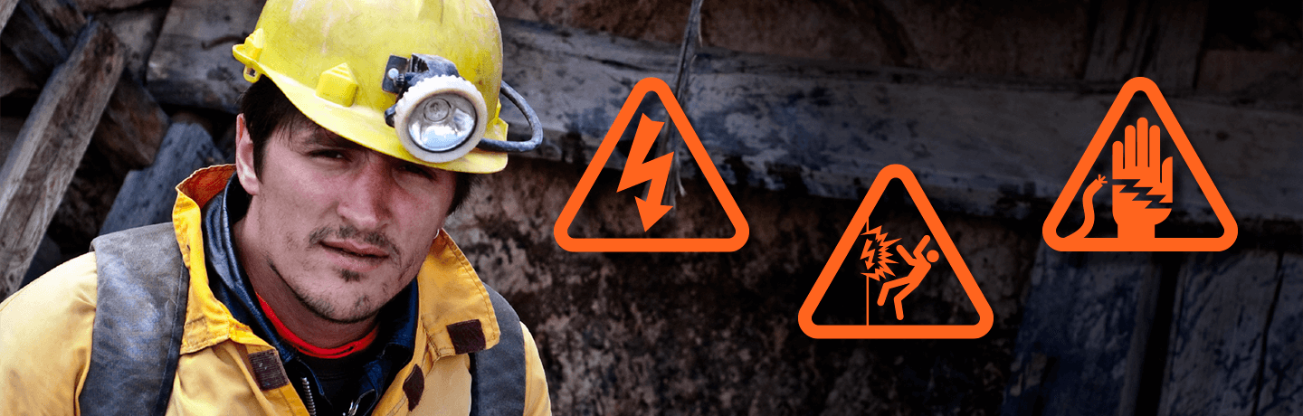 Arc flash signs next to a miner