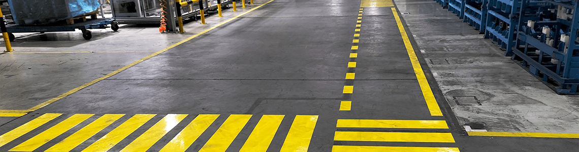 Floor Marking in a factory designating crossing areas.