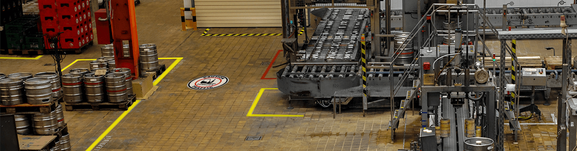 A brewery with a floor marking and wayfinding system in place.