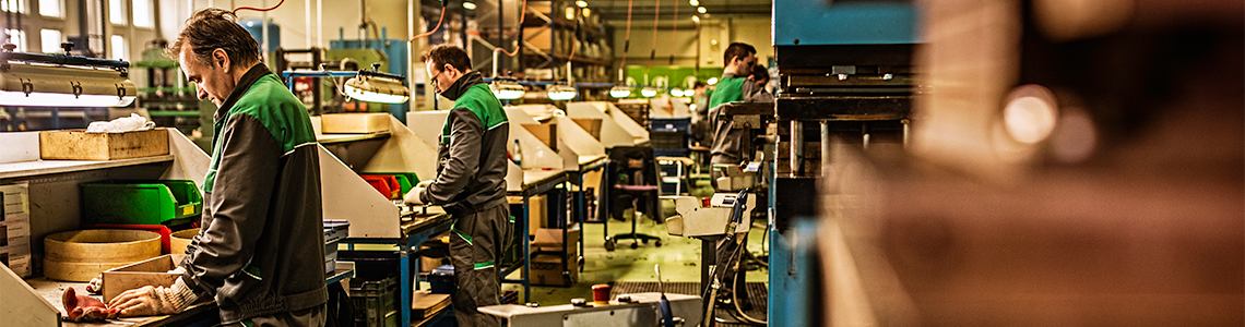 Factory workers busy at their stations