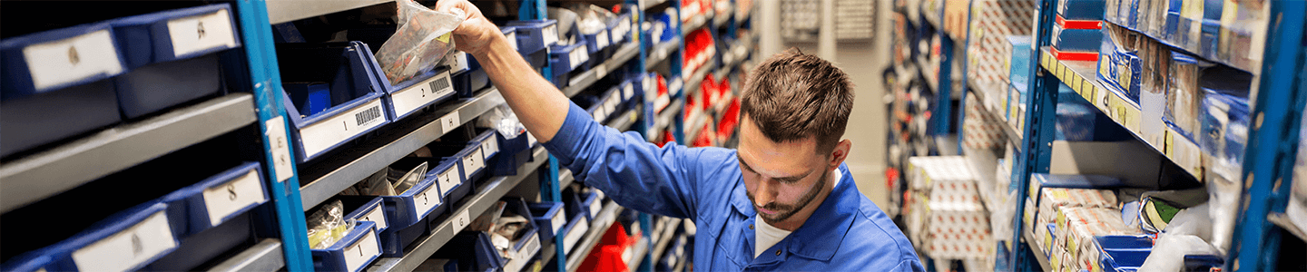 Man organizing items on shelf