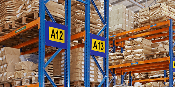 5S labeling and organization techniques are shown in on warehouse shelving.