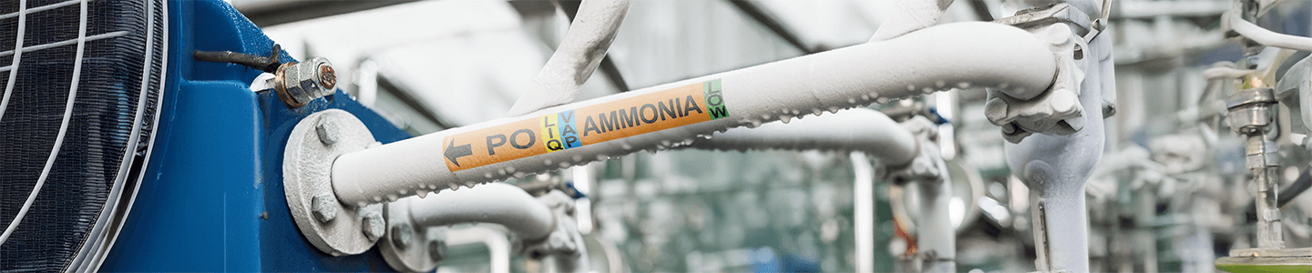 GHS-compliant ammonia pipe label for refrigeration system.