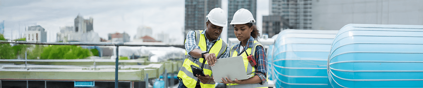 Mechanical project manager discussing a project with a worker.