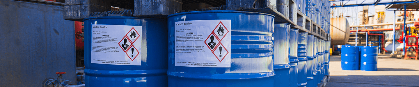 Bilingual caution signs warning of radiation in restricted area.