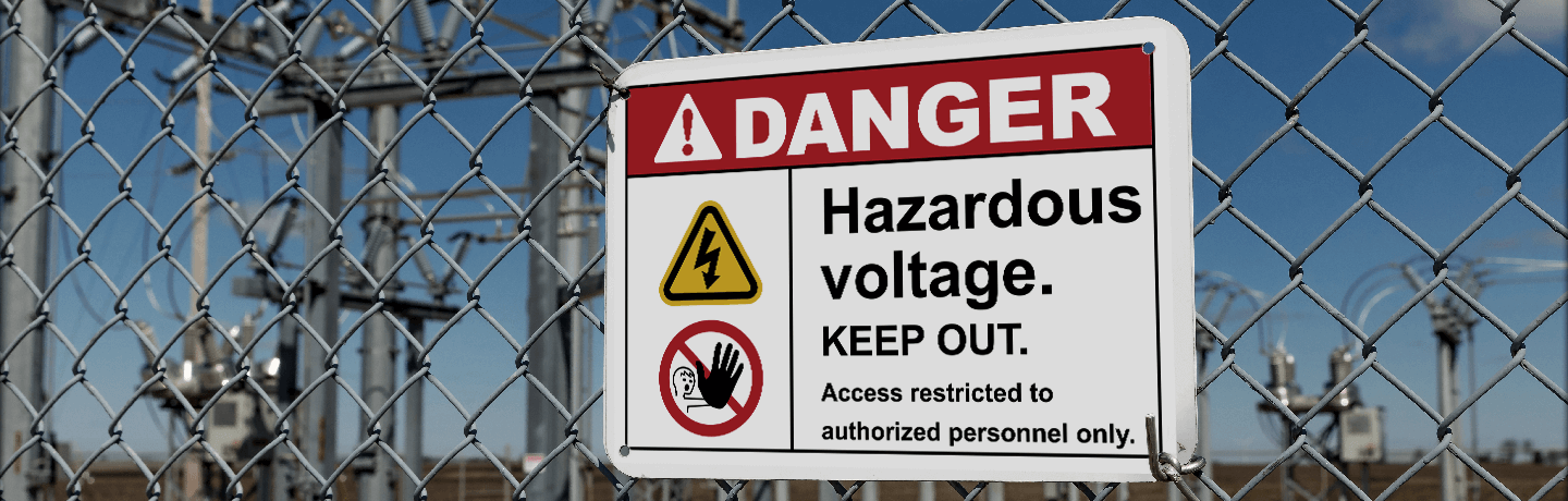 Danger Hazardous Voltage Sign on a Cyclone Fence