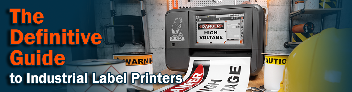 The definitive guide to industrial label printers banner showing a Kodiak Max industrial label printer producing safety signs and labels while sitting on a work bench