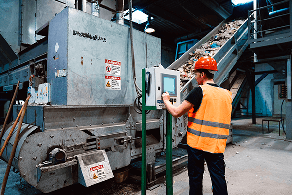 Custom safety label applied to manufacturing equipment, supporting facility visual systems and clear hazard communication.