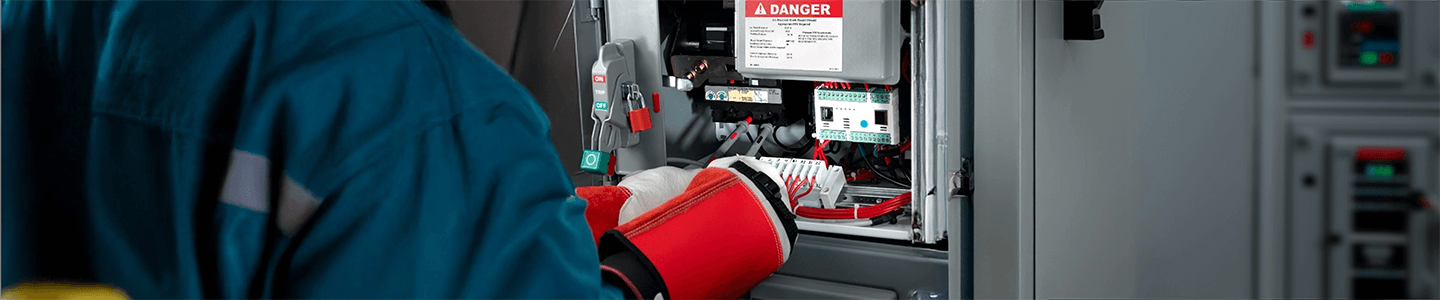 Worker in PPE demonstrating electrical safety