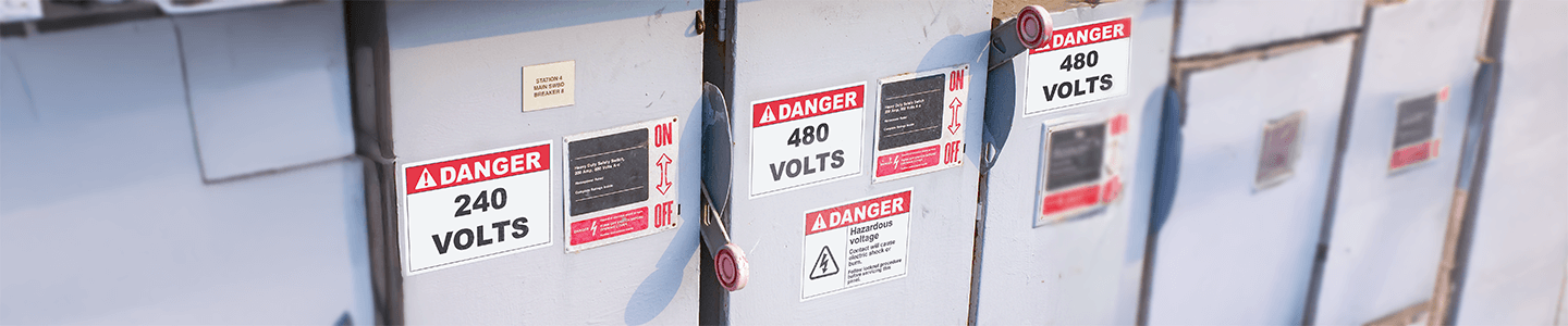 Electrical panels labeled with regulatory compliant danger labels.