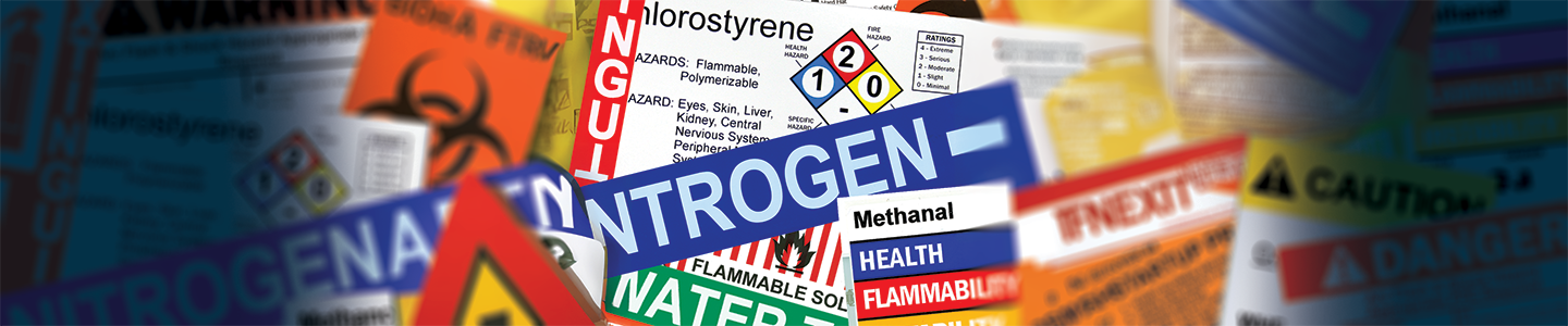 Various safety signs and labels with different messaging.