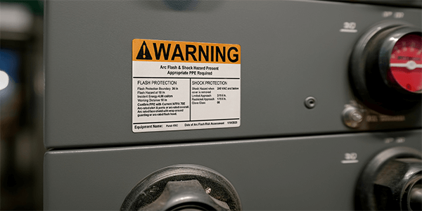 Legacy labels like this one may no longer meet code under NFPA 70 (2026). Generic warnings aren’t enough.