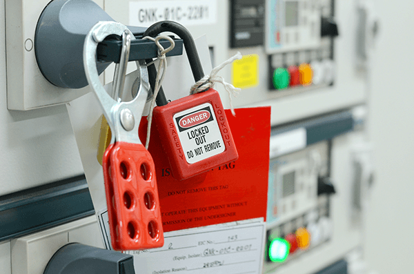 Lockout/tagout device and danger tag secured to electrical equipment.