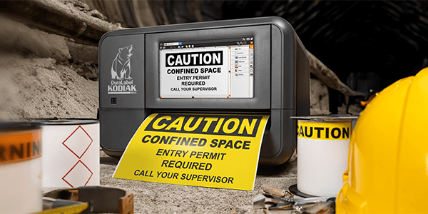 DuraLabel Kodiak Max Industrial Sign and Label Printer printing a caution sign.