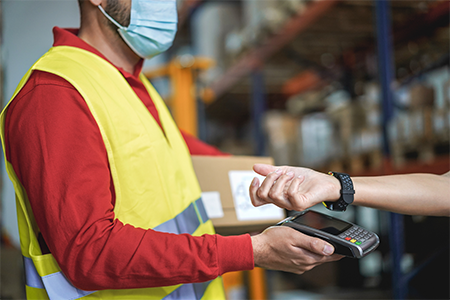 Worker wearing tech glasses looking at data.