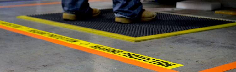 The floor of a manufacturing/warehouse facility marked with 5S floor marking tape.