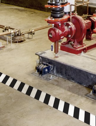 Floor makring alerts workers to an ammonia system.