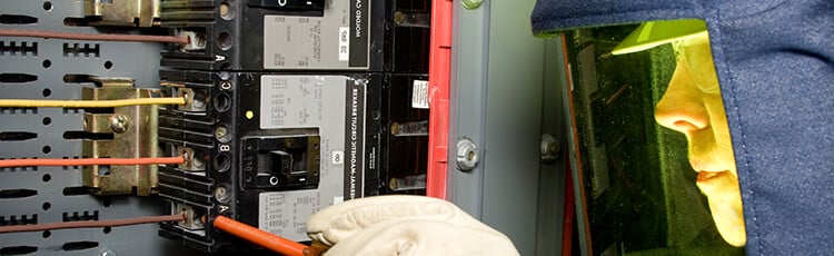 Worker conducting an Arc Flash Hazard Analysis.