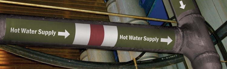 A facilities pipe with a how water supply pipe marking label