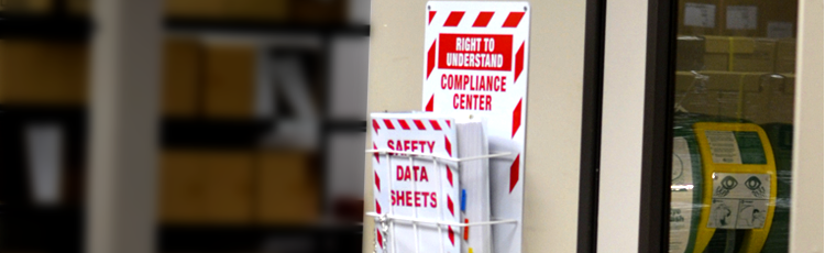 Compliance material and SDS hung on the wall for worker access