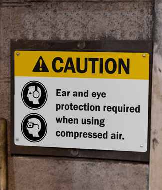 Caution sign reminds workers to wear ppe