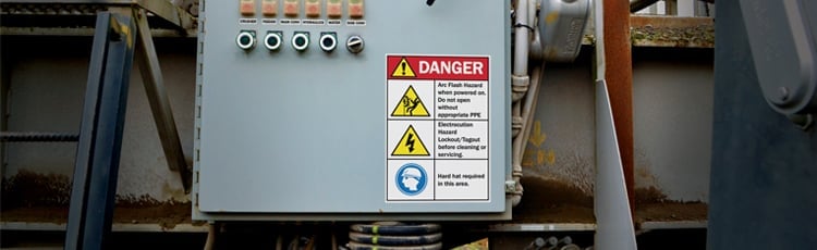 A control panel with an electrical safety label.