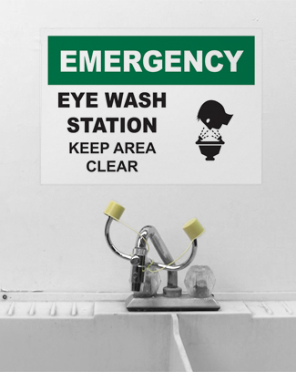 Signs alert to washing station safety rules.