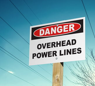 sign warns of power line dangers