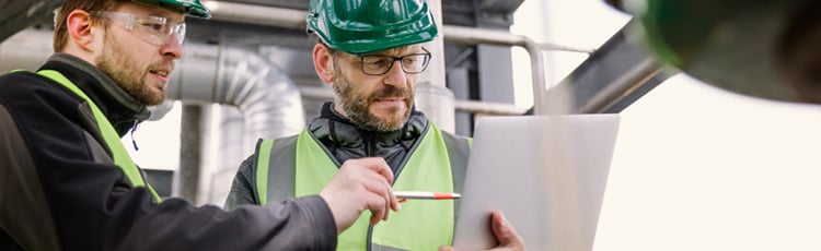 A worker reviews a safety data sheet (sds).