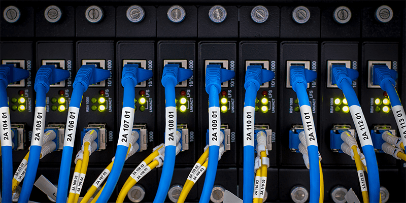 Labeled network connections and structured cabling within a data center environment.